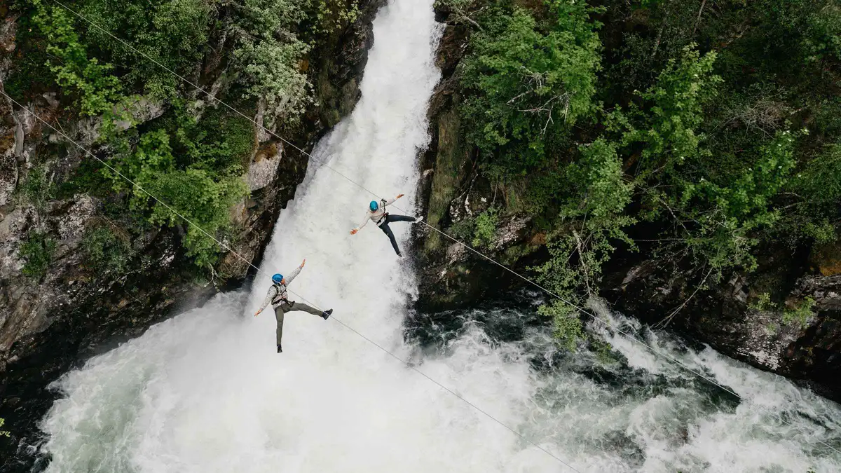 Zipline crossing the Geiranger River gorge — a land activity paired with a Geiranger fjord cruise in Norway